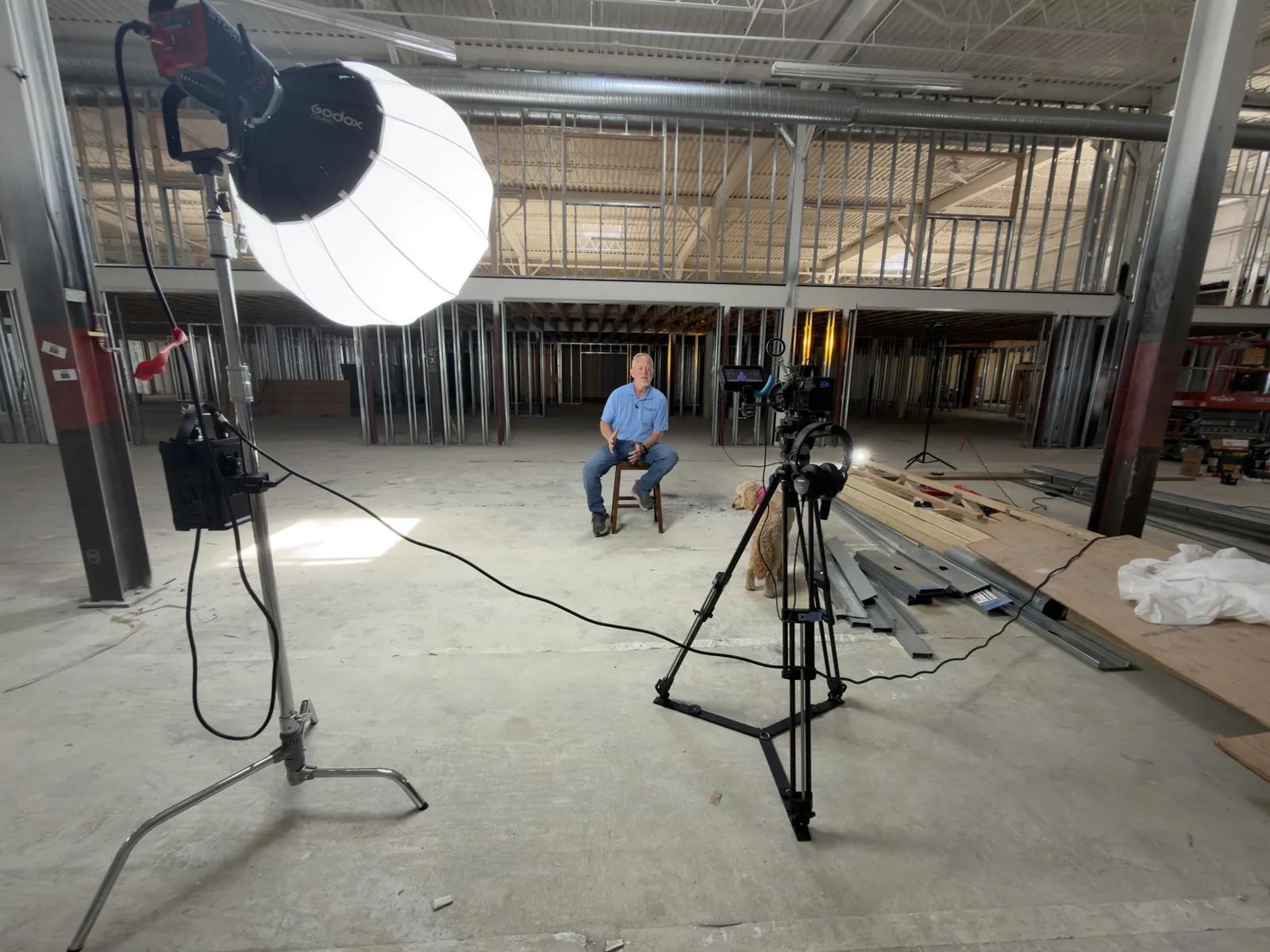 Flash of Grace video production set — Godox softbox lighting, cinema camera on tripod, and a seated subject in a Connecticut commercial build-out