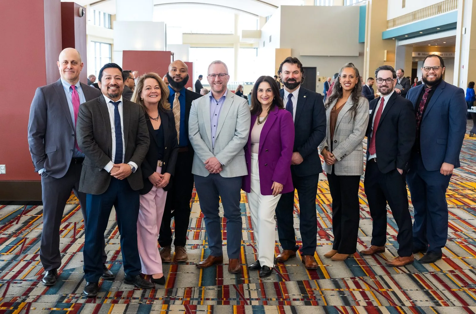 Leadership team group photo on the concourse of a Connecticut convention center